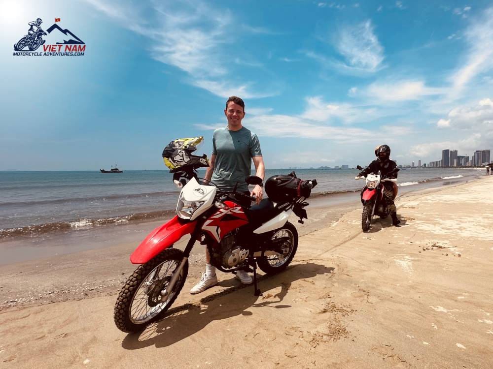 Vietnam Motorcycle Adventures convoy stops at a beach