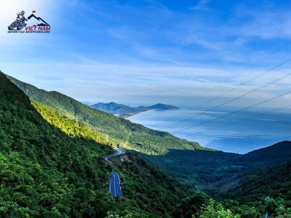 Discover the beauty of sunrise on Hai Van Pass, a time when bright light shines through clouds and mountains